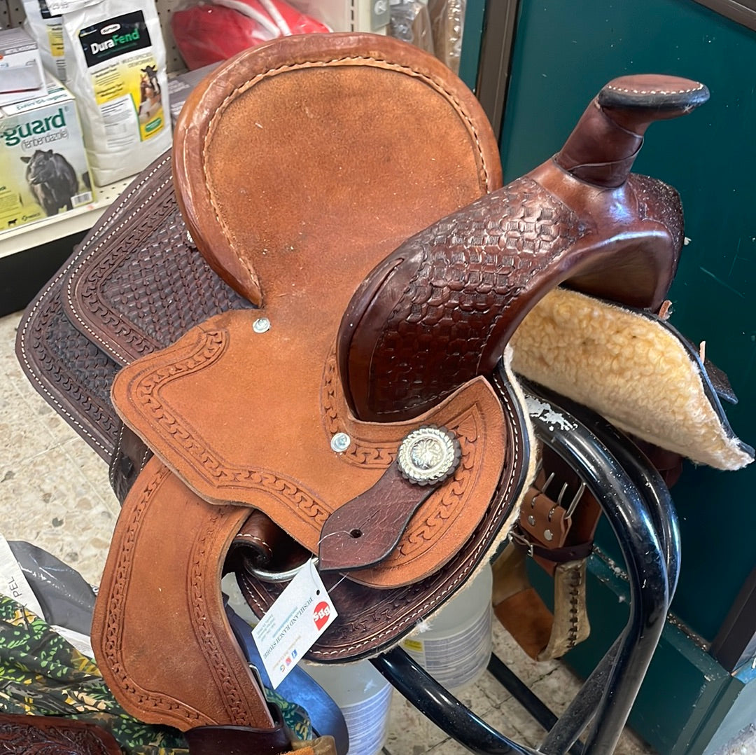Brown leather saddle with a tag on a store shelf