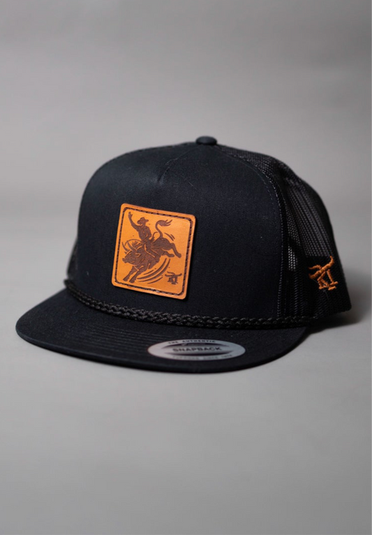 Black cap with orange logo on a gray background