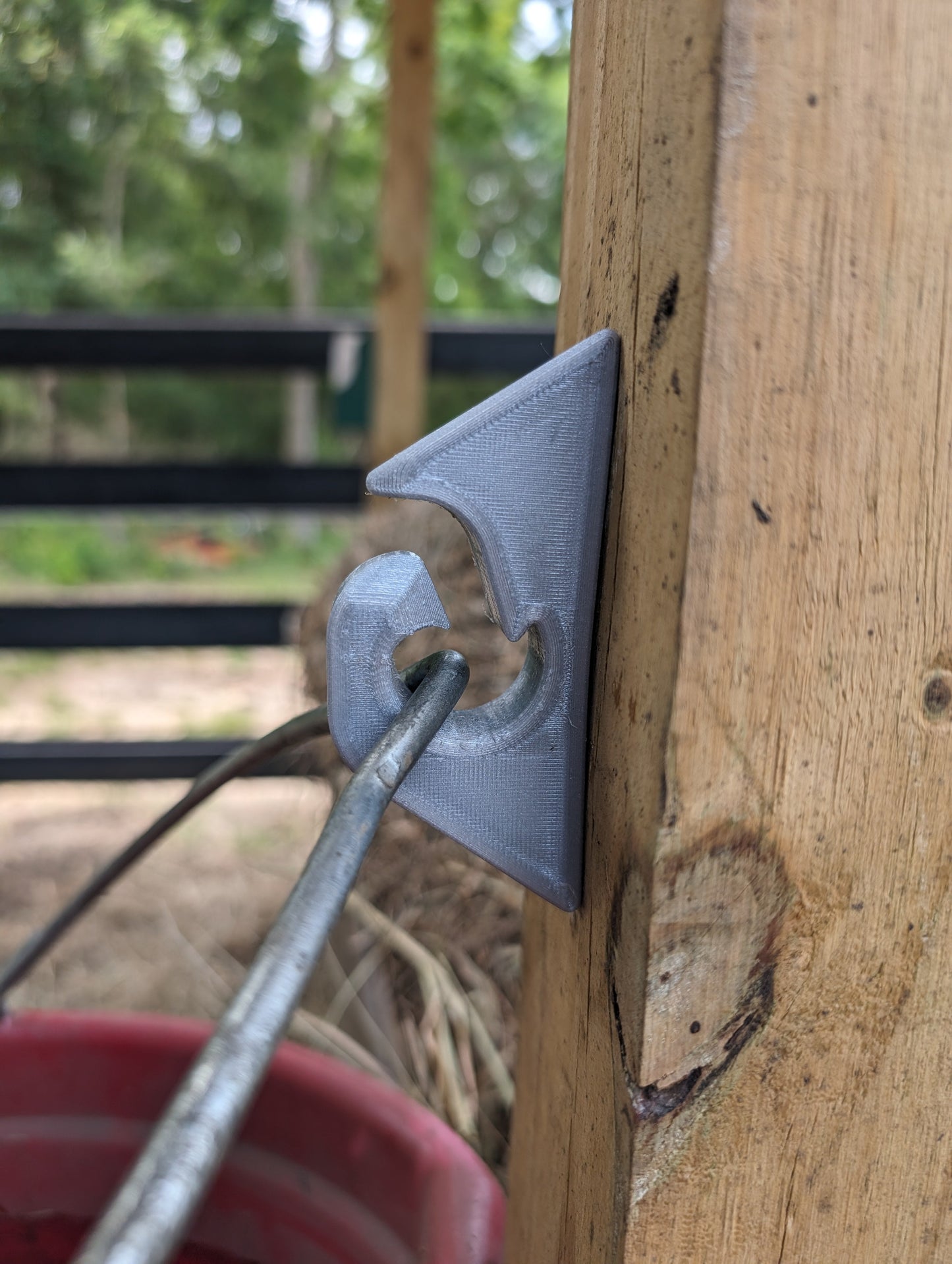 Metal tool being used on a wooden surface with a blurred background