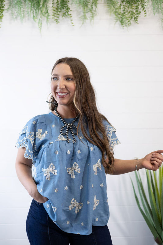 Umgee "All Tied Up" Bow Embroidered Denim Chambray Western Top — Scalloped Ruffle Sleeves Summer Charm (Medium remaining)