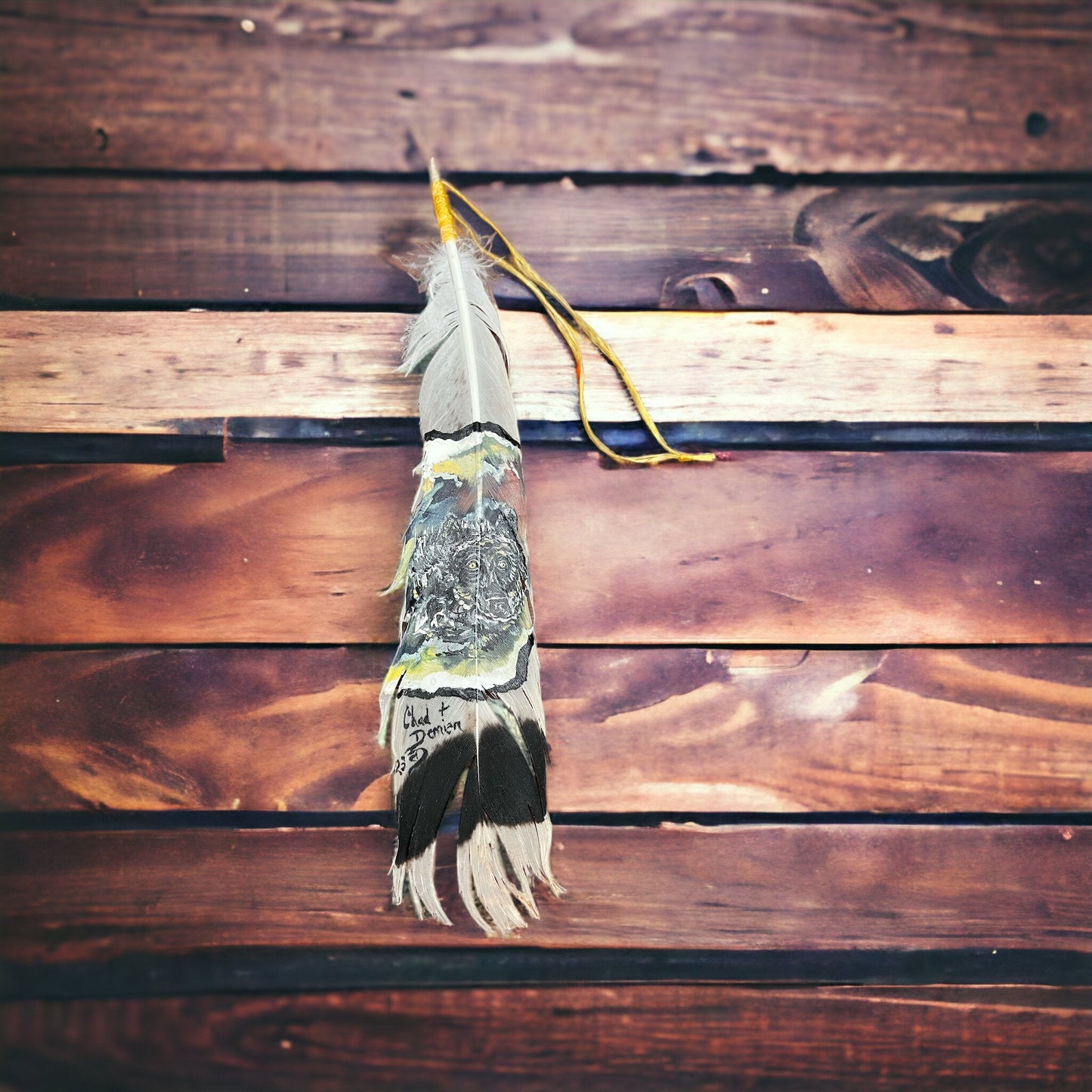 Painted hat feather by Chad Demien
