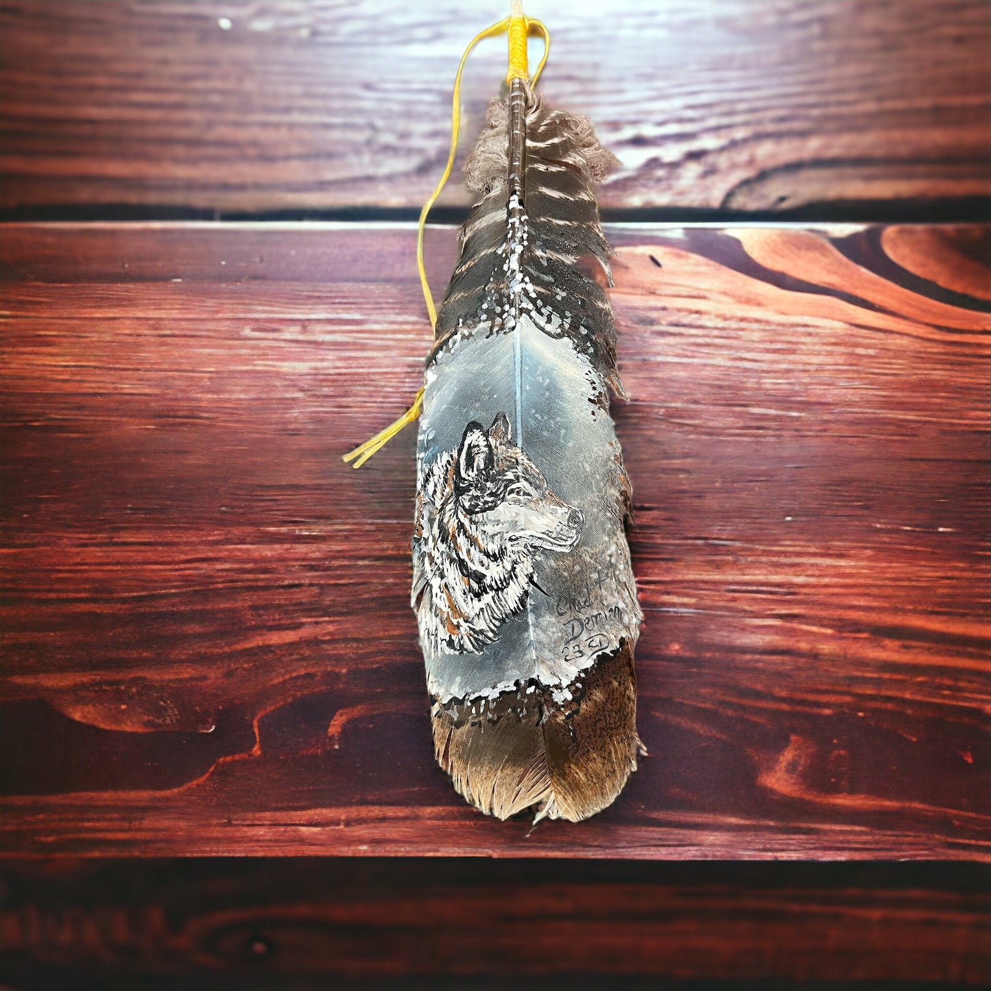 Painted hat feather by Chad Demien - Wolf